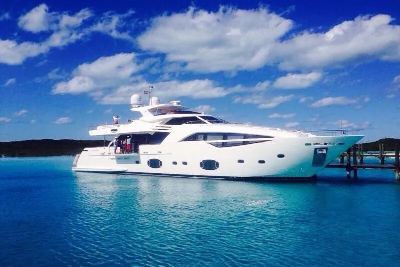 Sha Sha Sha IV Yacht Photos Pics Luxurious 2014 Custom Line 100 yacht docked in clear blue waters under a bright sky.