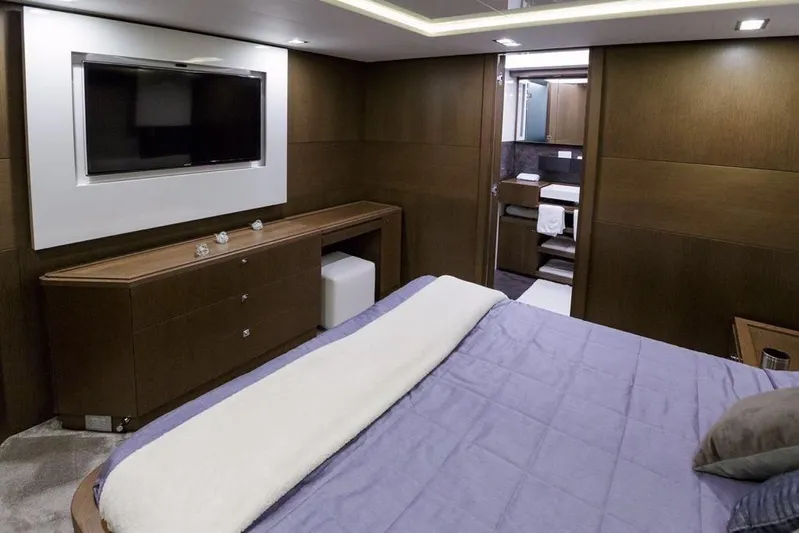 Sha Sha Sha IV Yacht Photos Pics Luxurious 2014 Custom Line 100 yacht bedroom with modern decor and flat-screen TV.