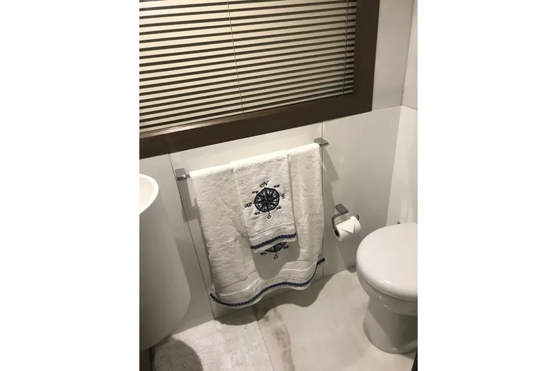 Sha Sha Sha IV Yacht Photos Pics Compact bathroom with nautical-themed towel, toilet, and modern fixtures, Custom Line 100, 2014.