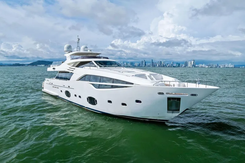 Sha Sha Sha IV Yacht Photos Pics Luxurious 2014 Custom Line 100 yacht cruising on open water with city skyline backdrop.