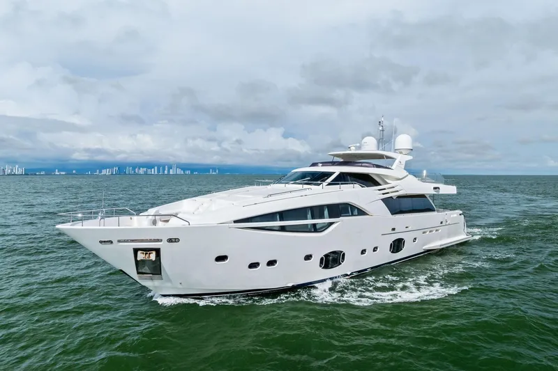 Sha Sha Sha IV Yacht Photos Pics Luxurious 2014 Custom Line 100 yacht cruising on open sea with city skyline backdrop.