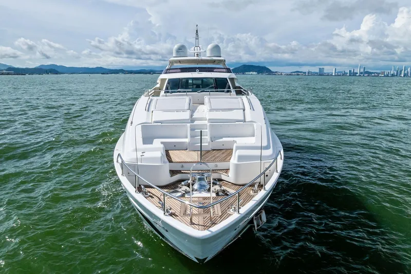 Sha Sha Sha IV Yacht Photos Pics Luxurious 2014 Custom Line 100 yacht cruising on open water with city skyline backdrop.