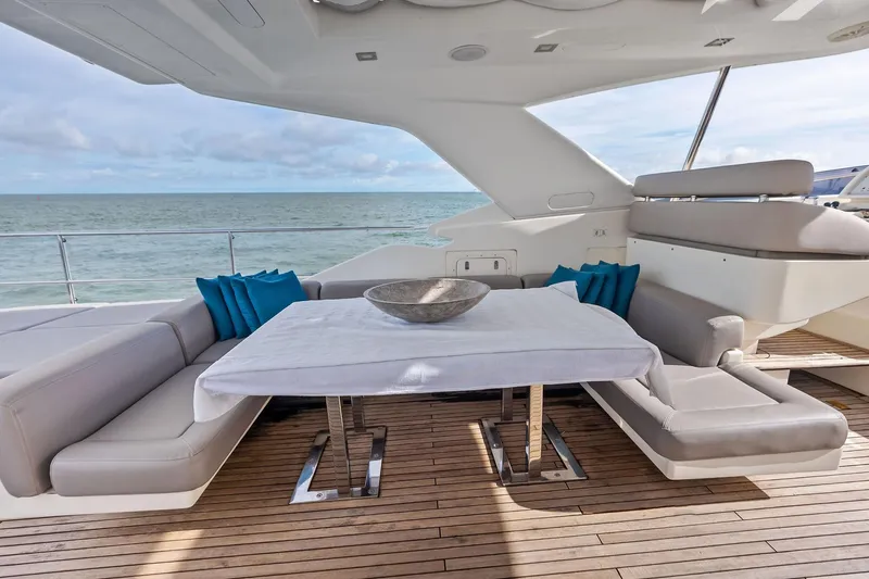 Sha Sha Sha IV Yacht Photos Pics Luxurious 2014 Custom Line 100 yacht deck with elegant seating and ocean view.