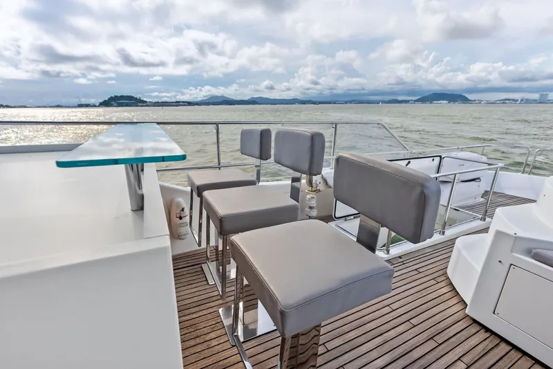 Sha Sha Sha IV Yacht Photos Pics Luxurious 2014 Custom Line 100 yacht deck with modern seating and ocean view.