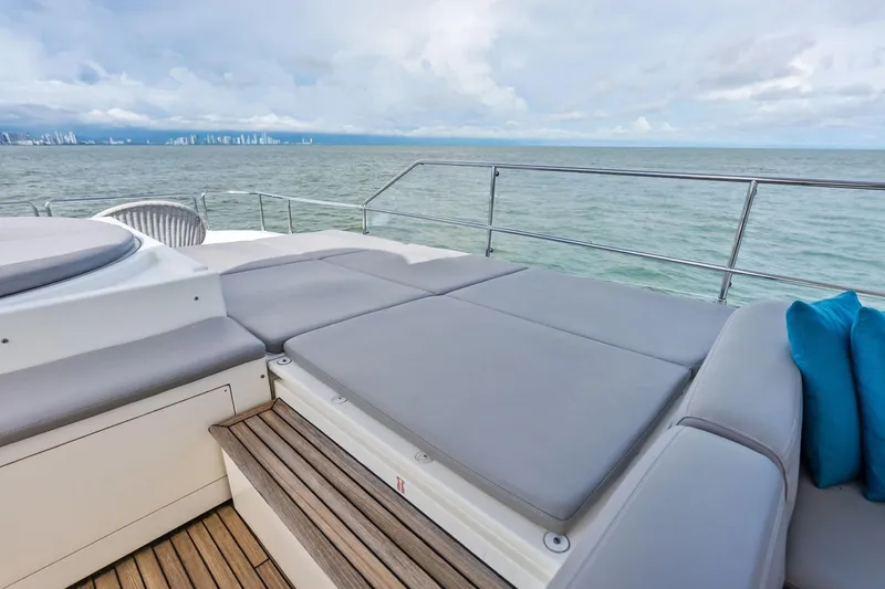 Sha Sha Sha IV Yacht Photos Pics Luxurious 2014 Custom Line 100 yacht deck with cushioned seating and ocean view.