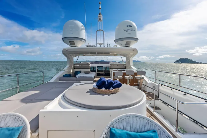 Sha Sha Sha IV Yacht Photos Pics Luxurious 2014 Custom Line 100 yacht deck with seating, ocean view, and clear skies.