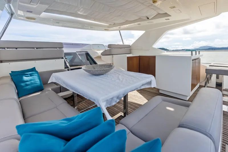 Sha Sha Sha IV Yacht Photos Pics Luxurious 2014 Custom Line 100 yacht interior with elegant seating and ocean view.