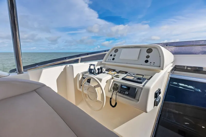 Sha Sha Sha IV Yacht Photos Pics Helm of 2014 Custom Line 100 yacht with ocean view and clear sky.