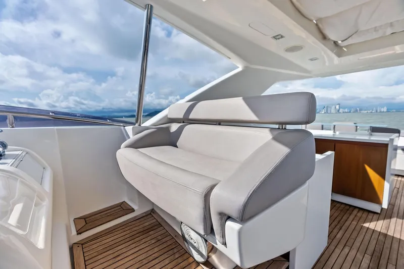 Sha Sha Sha IV Yacht Photos Pics Luxurious 2014 Custom Line 100 yacht interior with sleek seating and ocean view.