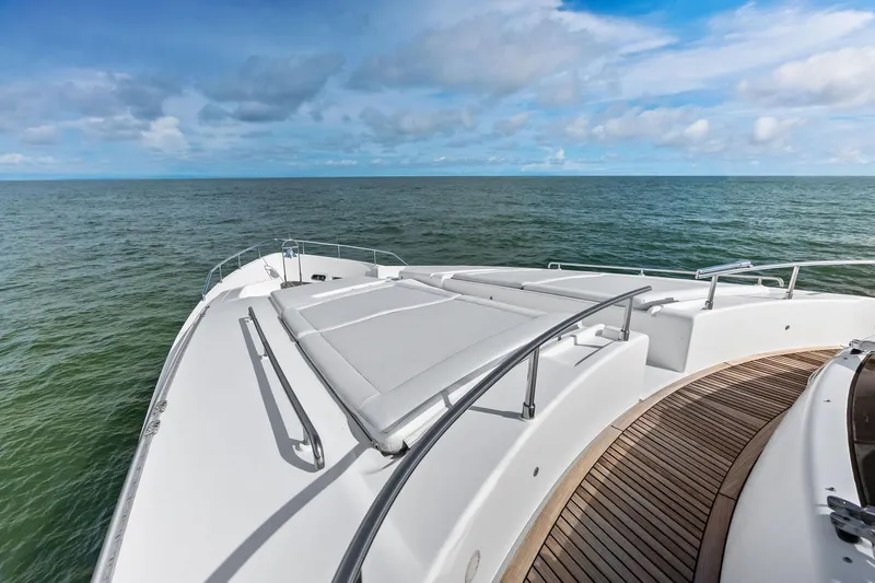 Sha Sha Sha IV Yacht Photos Pics Luxurious 2014 Custom Line 100 yacht deck with ocean view and sunbathing area.