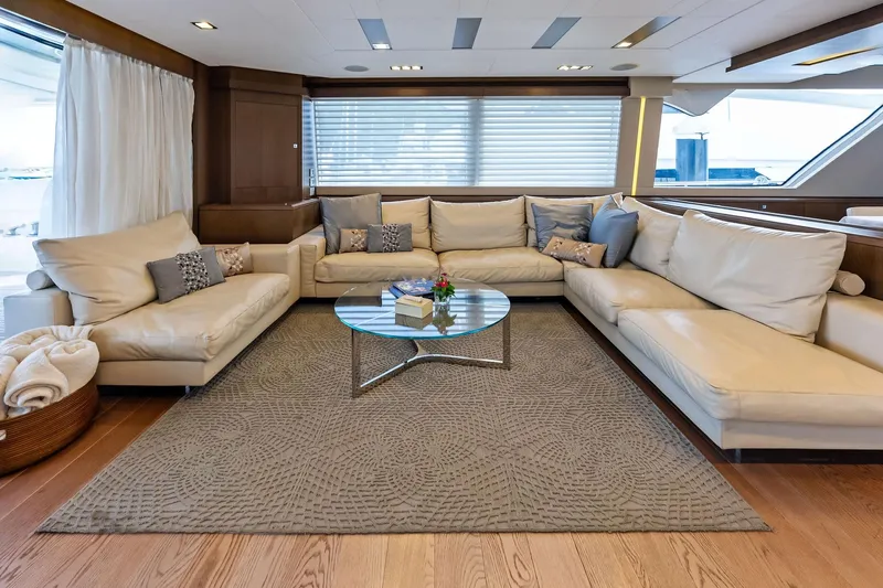 Sha Sha Sha IV Yacht Photos Pics Luxurious yacht interior with cream leather sofas, glass table, and elegant decor, Custom Line 100, 2014.