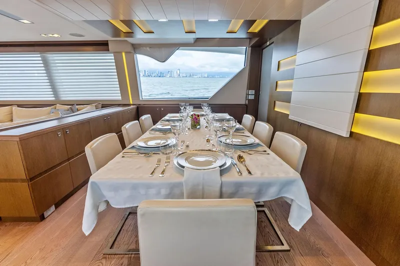 Sha Sha Sha IV Yacht Photos Pics Luxurious dining area on 2014 Custom Line 100 yacht with ocean view.