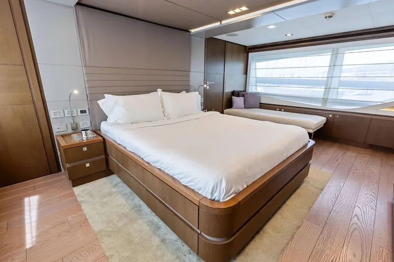 Sha Sha Sha IV Yacht Photos Pics Luxurious bedroom interior on 2014 Custom Line 100 yacht with modern design and large window.