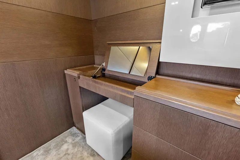 Sha Sha Sha IV Yacht Photos Pics Luxurious vanity area in 2014 Custom Line 100 yacht with wood finish and mirror.