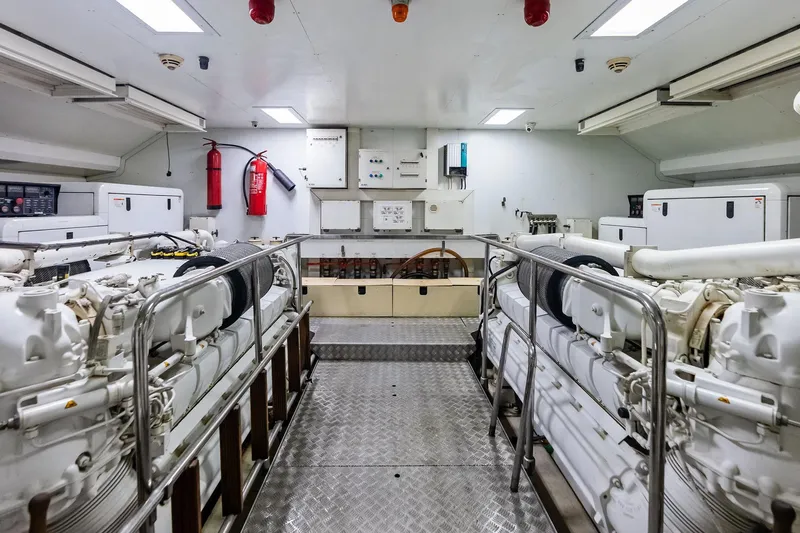 Sha Sha Sha IV Yacht Photos Pics Engine room of 2014 Custom Line 100 yacht with dual engines and safety equipment.