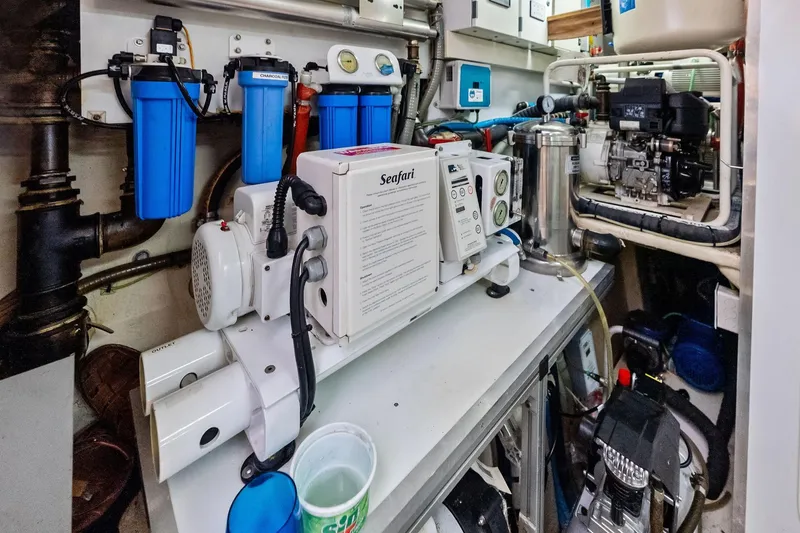 Sha Sha Sha IV Yacht Photos Pics Engine room of a 2014 Custom Line 100 yacht with water filtration system.
