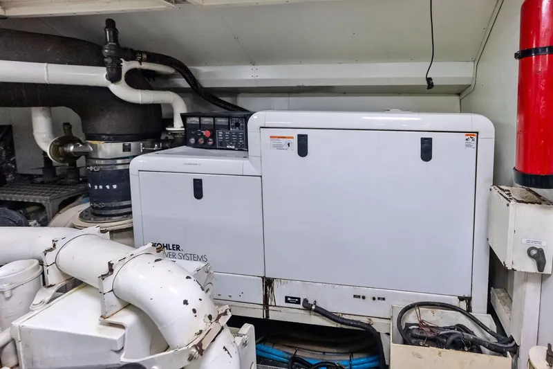 Sha Sha Sha IV Yacht Photos Pics Engine room with Kohler power system in a 2014 Custom Line 100 yacht.