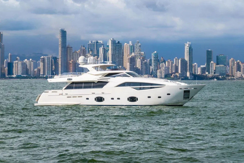 Sha Sha Sha IV Yacht Photos Pics Luxurious 2014 Custom Line 100 yacht cruising near a city skyline.