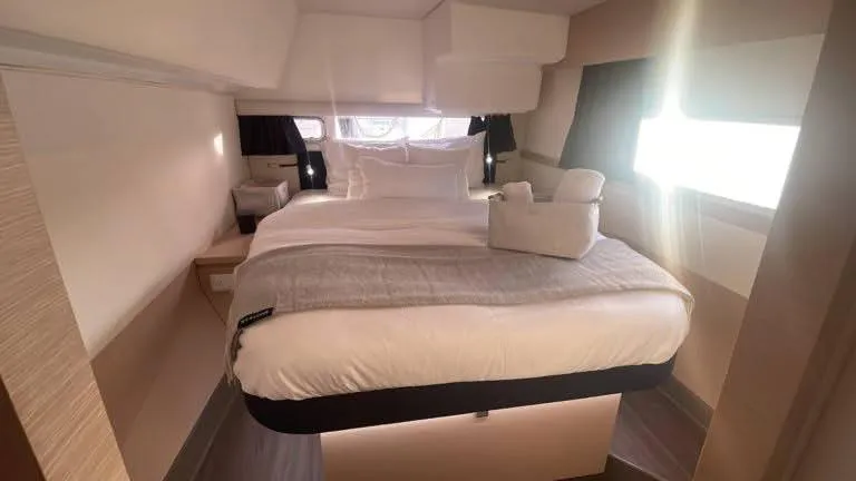 Carpe Aura Yacht Photos Pics Luxurious bedroom interior of 2018 Fountaine Pajot Helia 44 catamaran with cozy bedding.