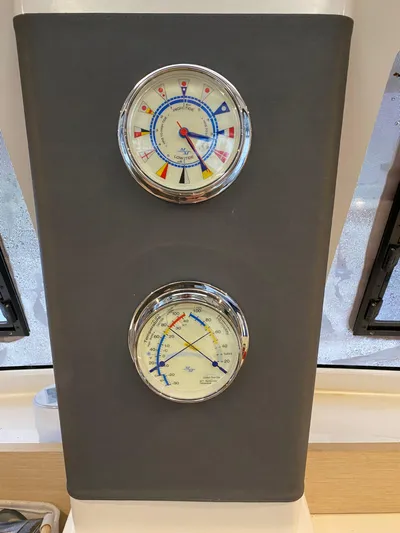 Carpe Aura Yacht Photos Pics Fountaine Pajot Helia 44 2018 yacht gauges, featuring barometer and hygrometer.