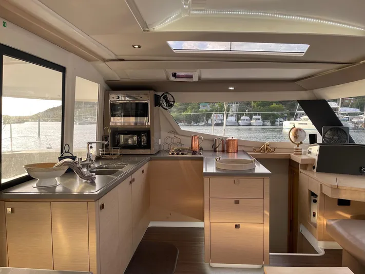 Carpe Aura Yacht Photos Pics Luxurious 2018 Fountaine Pajot Helia 44 yacht interior kitchen with modern amenities.