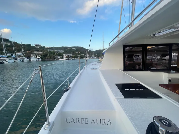 Carpe Aura Yacht Photos Pics Fountaine Pajot Helia 44 catamaran, 2018 model, docked in a scenic marina.