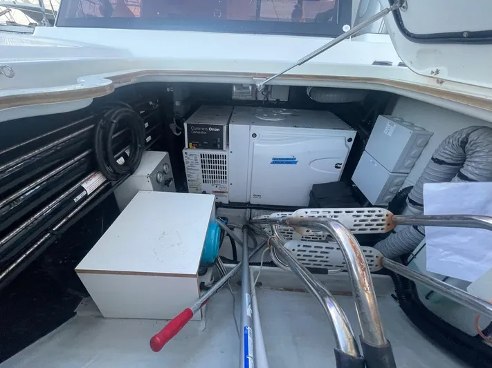 Carpe Aura Yacht Photos Pics Engine compartment of 2018 Fountaine Pajot Helia 44 catamaran, showcasing equipment and storage.