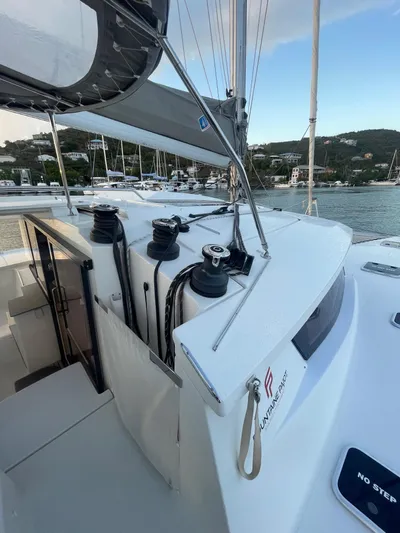 Carpe Aura Yacht Photos Pics Fountaine Pajot Helia 44 catamaran deck, 2018 model, docked in a marina.