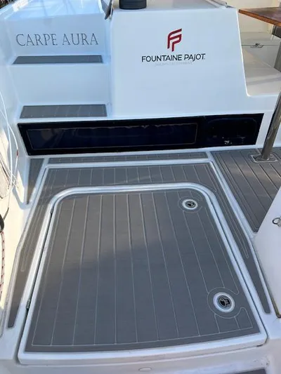Carpe Aura Yacht Photos Pics Fountaine Pajot Helia 44 catamaran deck, 2018 model, featuring "Carpe Aura" branding.