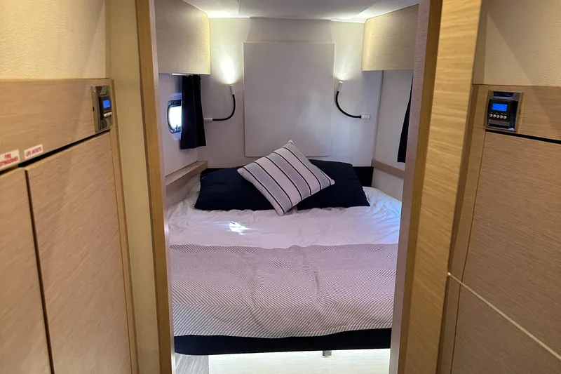 Carpe Aura Yacht Photos Pics Interior cabin of 2018 Fountaine Pajot Helia 44 catamaran with cozy bed and modern lighting.