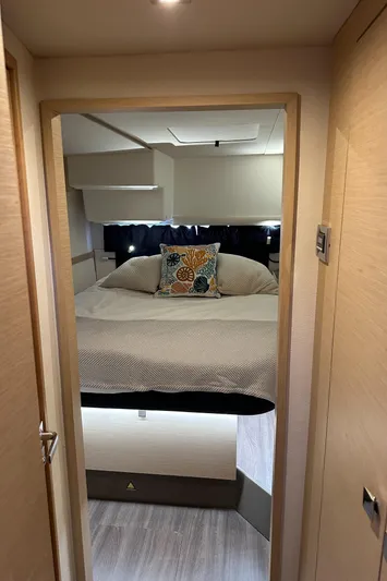 Carpe Aura Yacht Photos Pics Interior cabin of 2018 Fountaine Pajot Helia 44 catamaran, featuring a cozy bed and modern design.