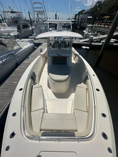  Yacht Photos Pics 2022 Cobia 350 Center Console boat docked, showcasing spacious seating and sleek design.