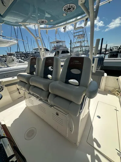  Yacht Photos Pics 2022 Cobia 350 Center Console boat interior with cushioned seating at marina.