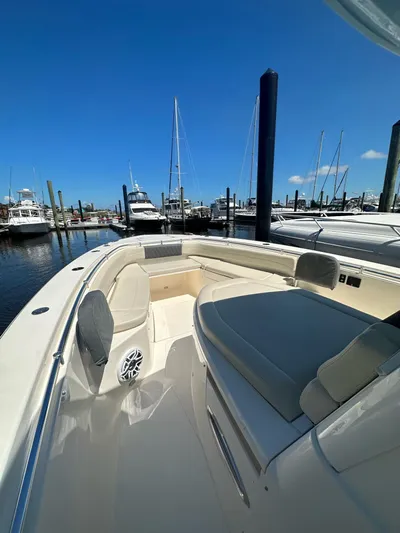  Yacht Photos Pics 2022 Cobia 350 Center Console boat docked at marina under clear blue sky.
