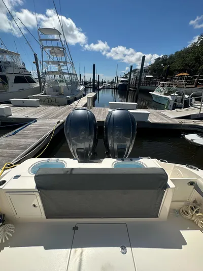  Yacht Photos Pics 2022 Cobia 350 Center Console boat docked with twin engines, clear sky background.