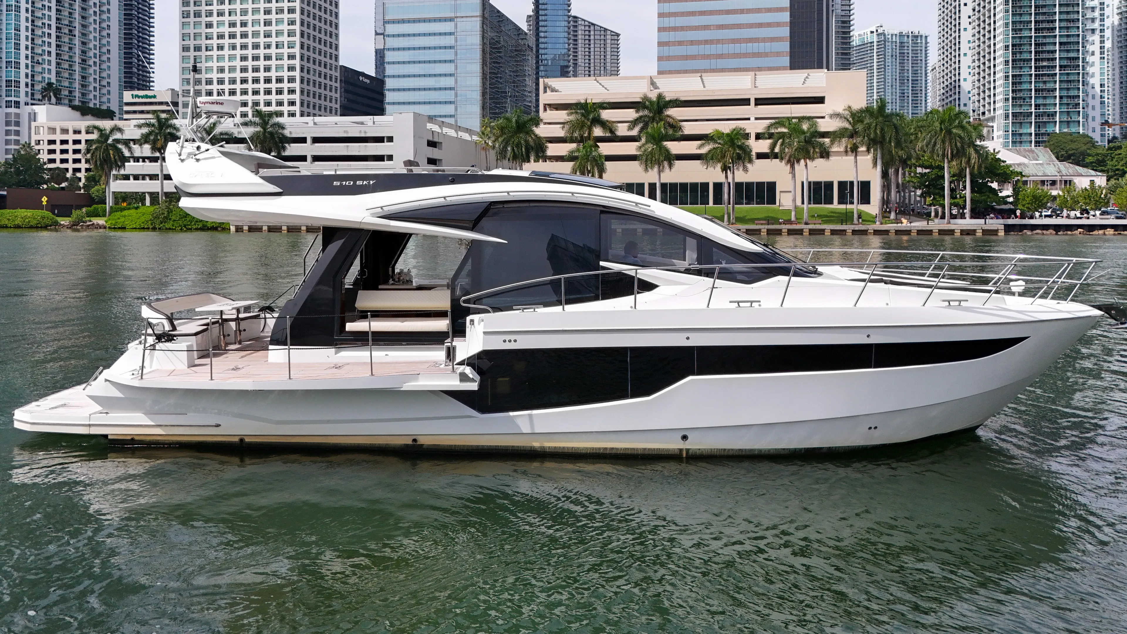  Yacht Photos Pics 2020 Galeon 510 Sky yacht against urban backdrop.