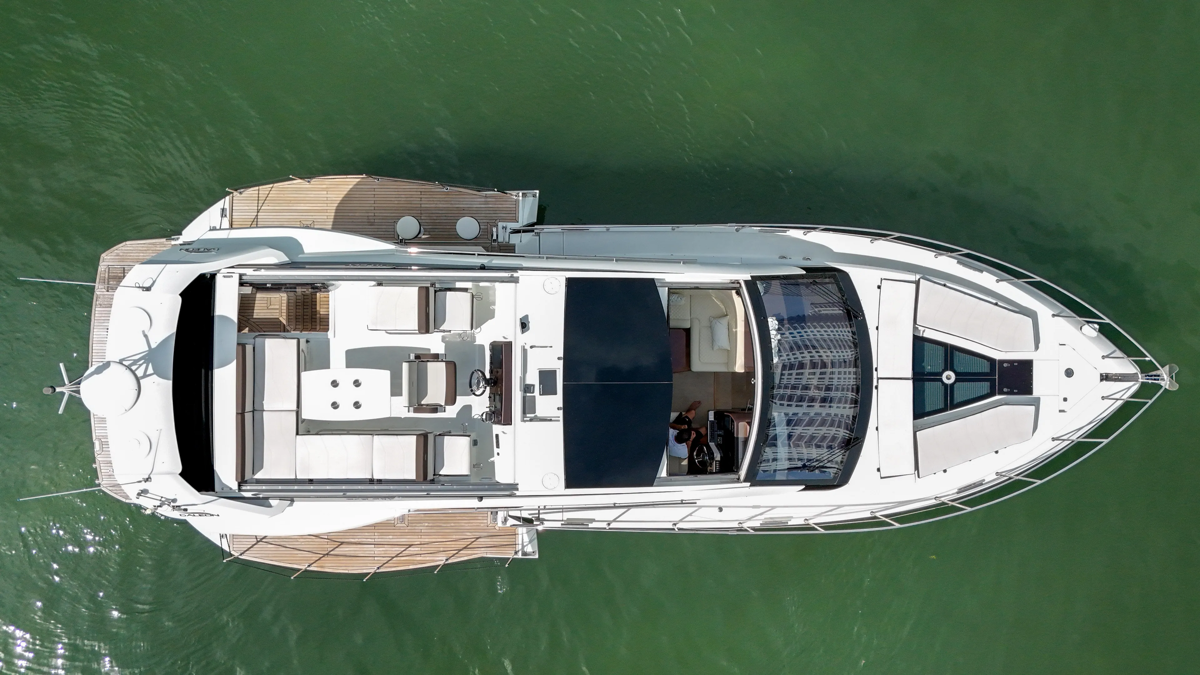 Yacht Photos Pics Aerial view of 2020 Galeon 510 Sky yacht on green water.