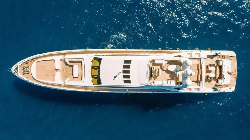  Yacht Photos Pics Aerial view of 2009 Mangusta 165 yacht on blue ocean water.