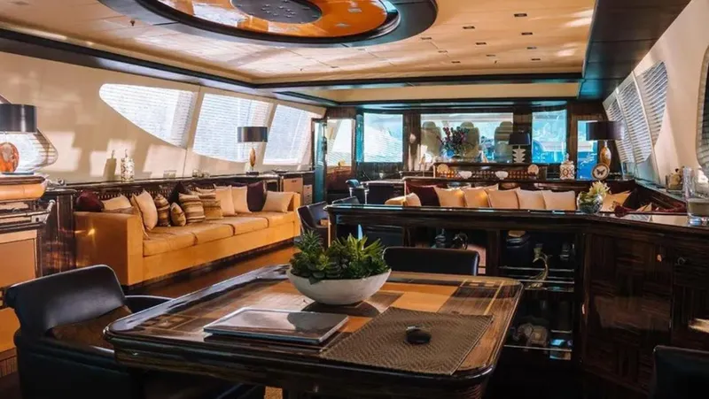  Yacht Photos Pics Luxurious interior of 2009 Mangusta 165 yacht with elegant seating and modern decor.