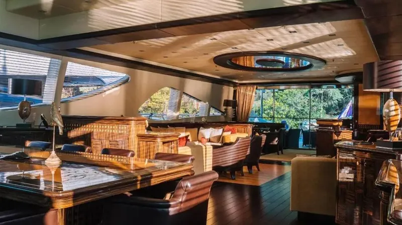  Yacht Photos Pics Luxurious interior of a 2009 Mangusta 165 yacht with elegant furnishings and large windows.