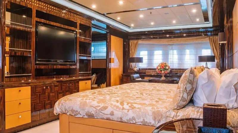  Yacht Photos Pics Luxurious bedroom interior on 2009 Mangusta 165 yacht with elegant decor and modern amenities.