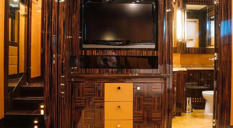  Yacht Photos Pics Luxurious interior of 2009 Mangusta 165 yacht featuring elegant wood paneling and modern amenities.