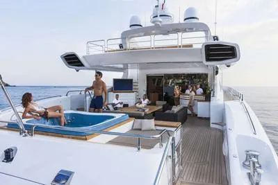  Yacht Photos Pics Luxurious 2009 Mangusta 165 yacht with jacuzzi and lounging area on deck.