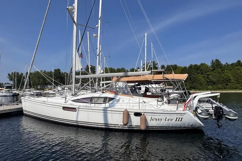 Yacht Photos Pics 2011 Jeanneau 50 DS sailboat docked in a marina under clear blue skies.
