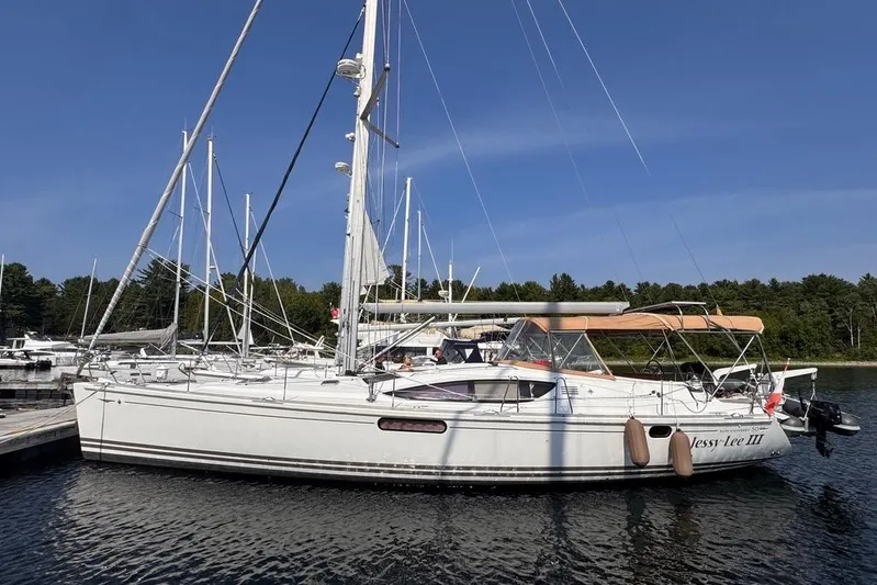  Yacht Photos Pics 2011 Jeanneau 50 DS sailboat docked in a marina under clear blue skies.