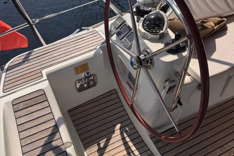  Yacht Photos Pics Cockpit of 2011 Jeanneau 50 DS sailboat with steering wheel and navigation instruments.