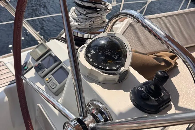  Yacht Photos Pics Cockpit of 2011 Jeanneau 50 DS sailboat with compass and navigation controls.