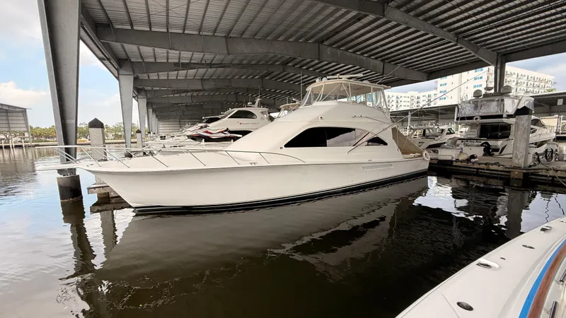 Steel Mahlin Yacht Photos Pics 2006 Ocean Yachts 57 Super Sport docked in a covered marina.