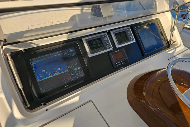 Team Turbo Yacht Photos Pics 2013 Viking 42 Convertible yacht dashboard with navigation and sonar displays.