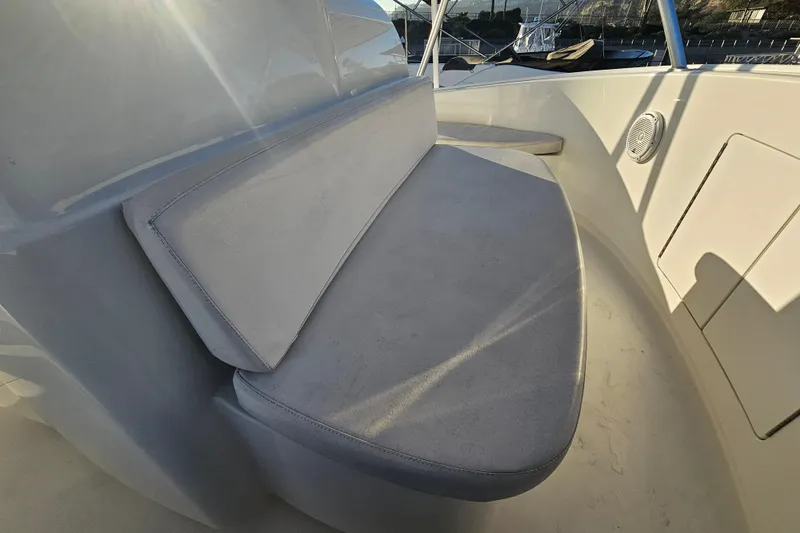 Team Turbo Yacht Photos Pics 2013 Viking 42 Convertible boat seating area with sunlight and speaker detail.